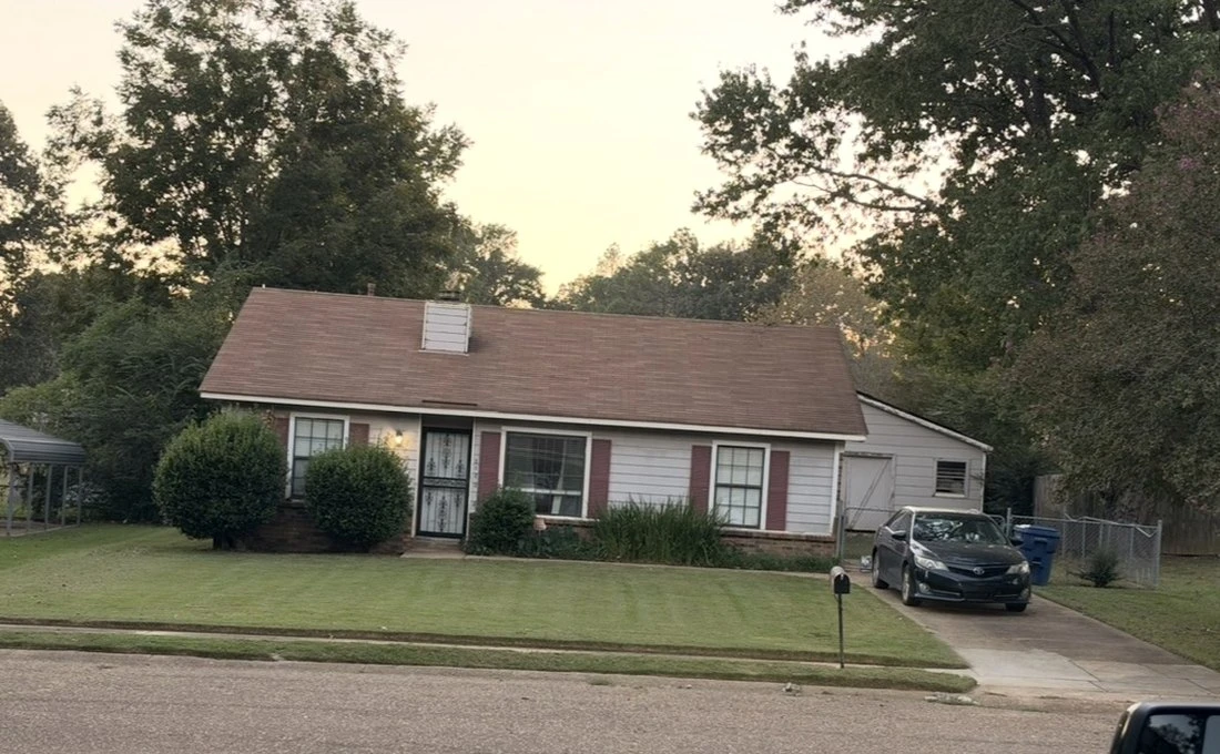 Finished lawn care at a home with an evenly cut front yard